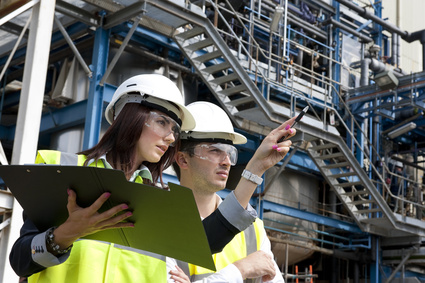 technicians working in industrial chemical plant